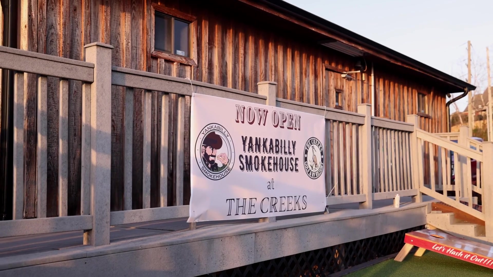 The rustic timber Yankabilly Smokehouse at The Creeks, glowing in the golden-hour light
